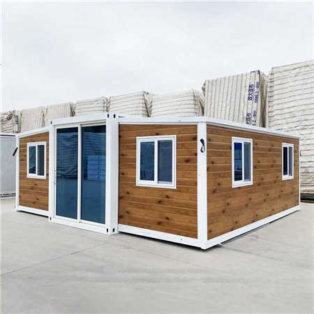 Expandable container House with wood grain panels and white frame on the exterior